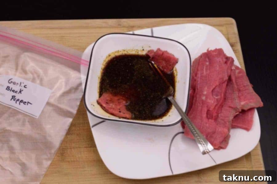 Garlic Black Pepper Marinating in bowl of marinade on plate with fork