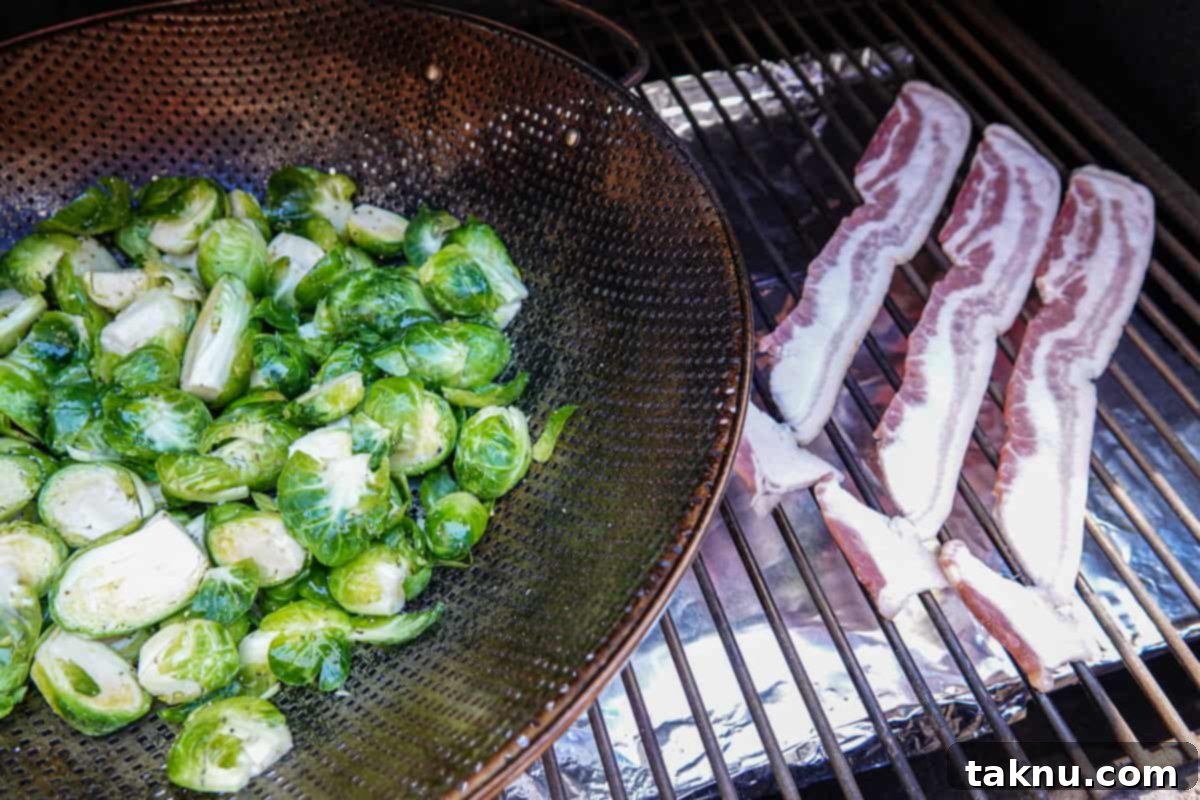 brussel sprouts in grill basket and bacon on smoker rack