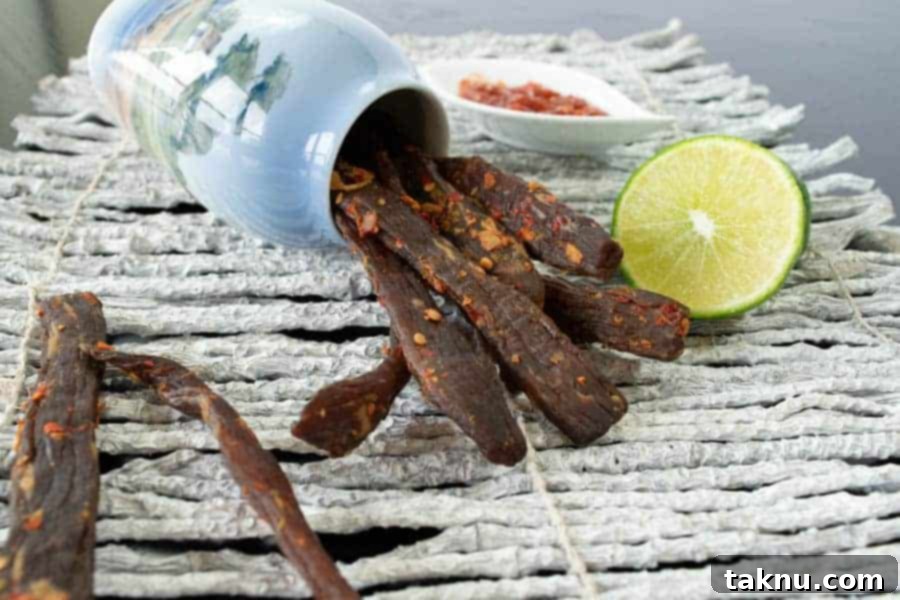 Mastering Oven Beef Jerky at Home 9 Chili Lime jerky with lime and chili garlic sauce in jar