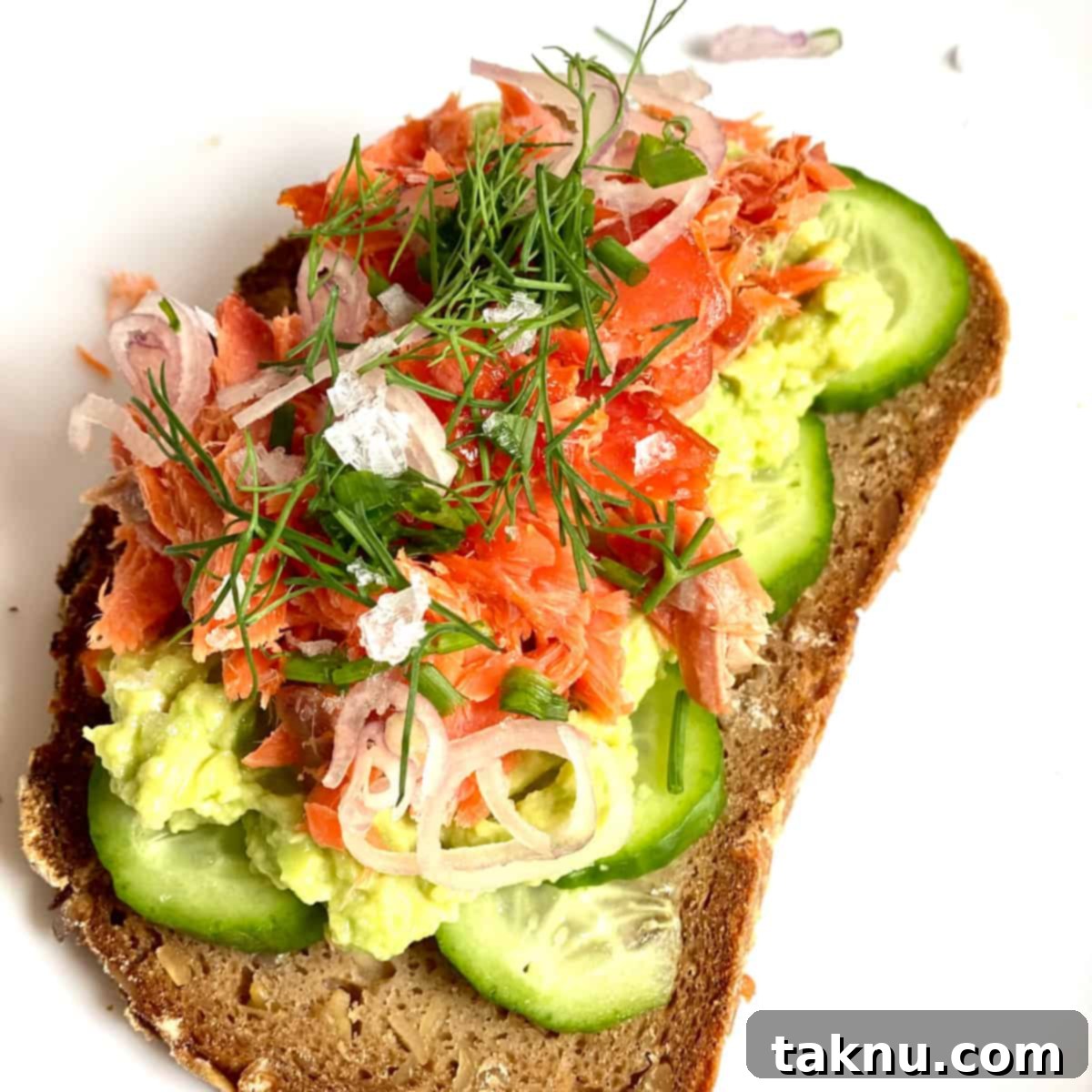 Toast with smoked salmon, cucumbers, dill, and shallots.