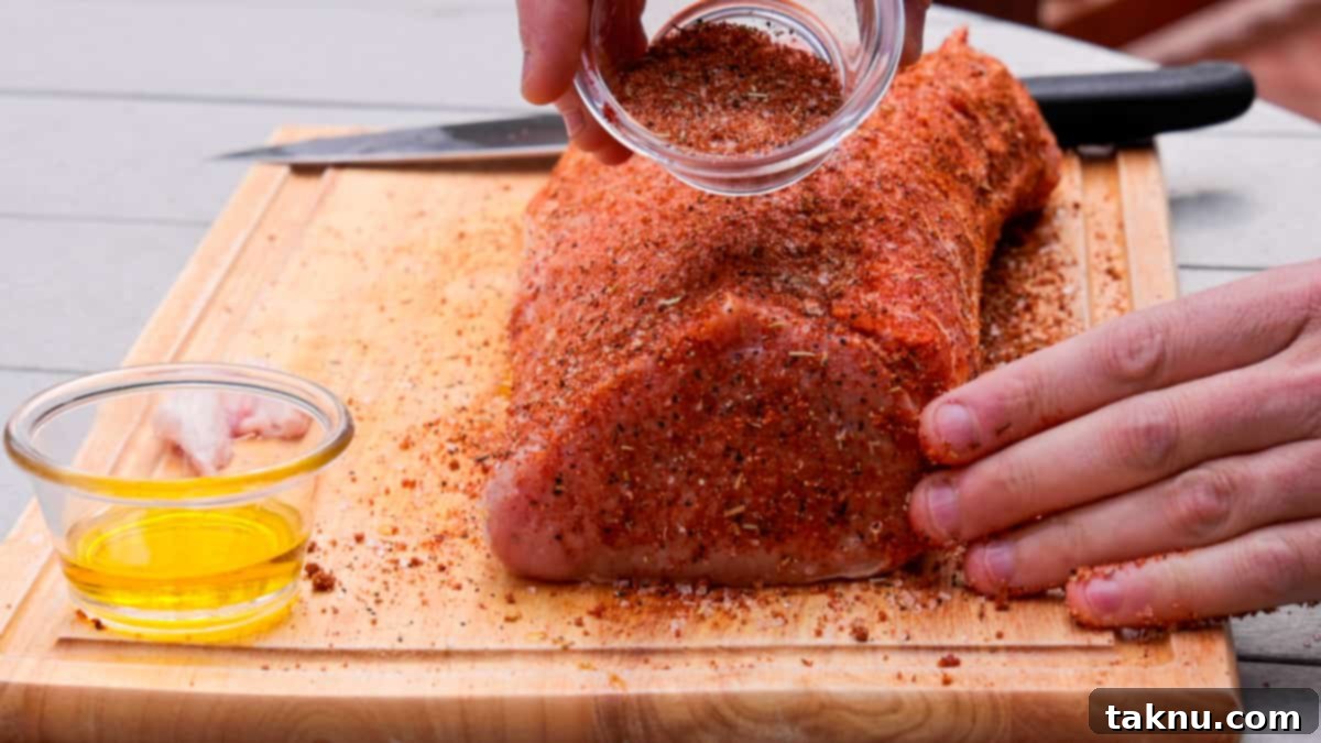 Seasoning pork on cutting board before smoking meat