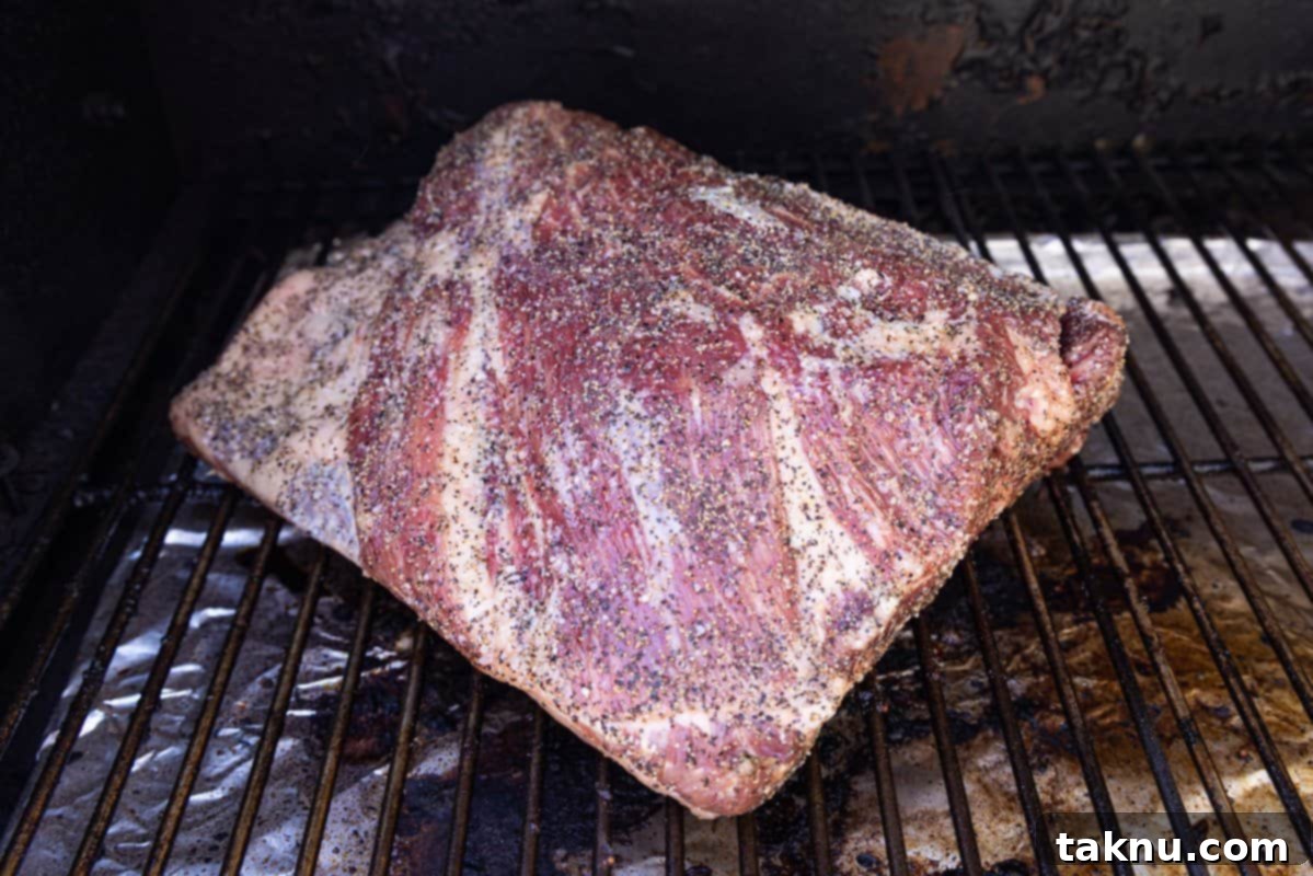 Giant Smoked Beef Ribs 5 beef ribs seasoned and put on smoker.