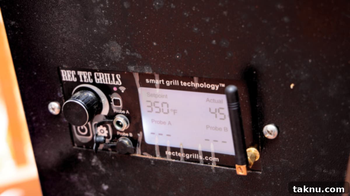 Ultimate Smoked Beer Can Chicken 8 Smoker digital settings display showing the temperature precisely set to 350°F for the final cooking stage of the chicken.