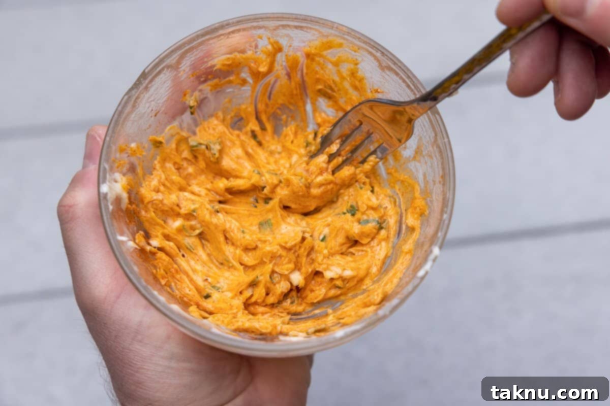 Butter spread in a bowl mixing with fork