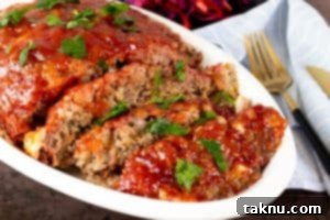 Sliced smoked meatloaf, showcasing its moist interior.