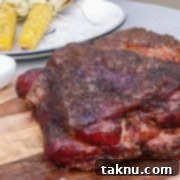 Sizzling Christmas BBQ Recipes 5 smoked pork butt on cutting board with corn in background