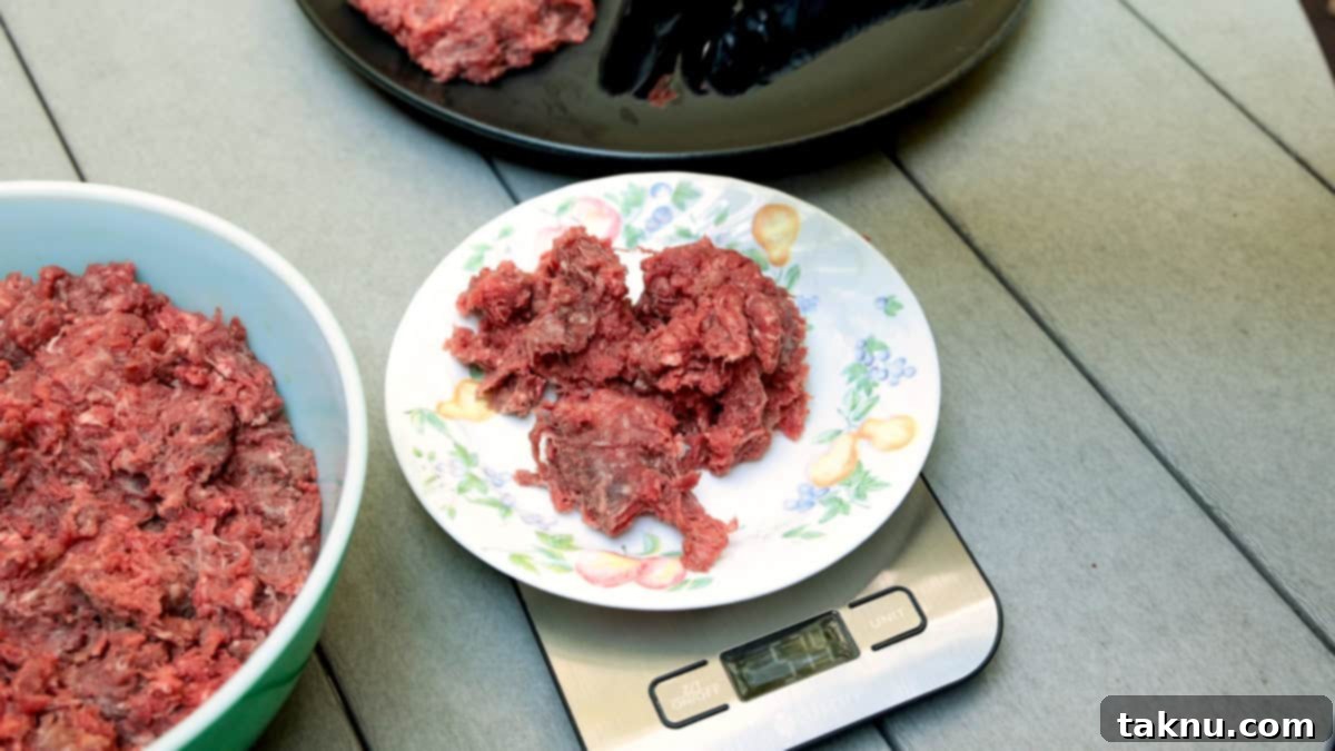 White plate with ground meat atop being weighed on scale.