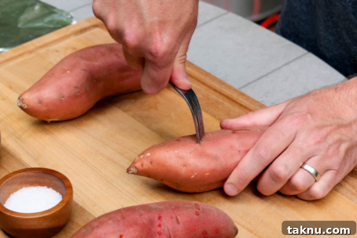 Poking holes in potatoes with fork on wood cutting board.