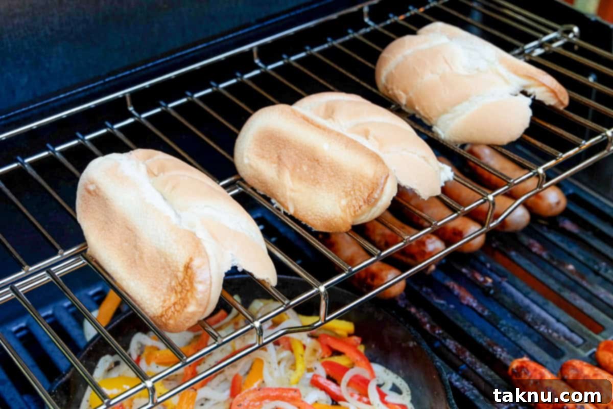 Savory Sausage and Roasted Peppers 9 Toasting sausage buns on grill.