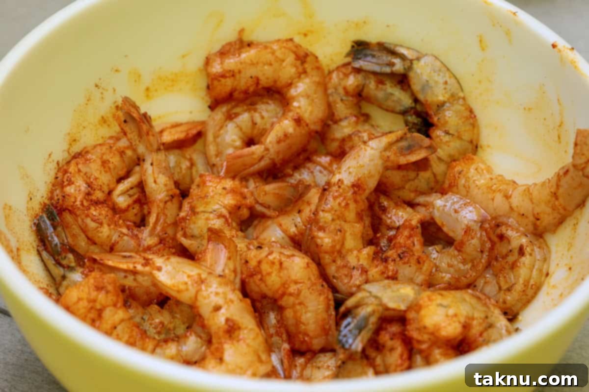Succulent Smoked Shrimp 7 A bowl filled with two dozen shrimp, perfectly seasoned and glistening with olive oil, ready for the smoker.