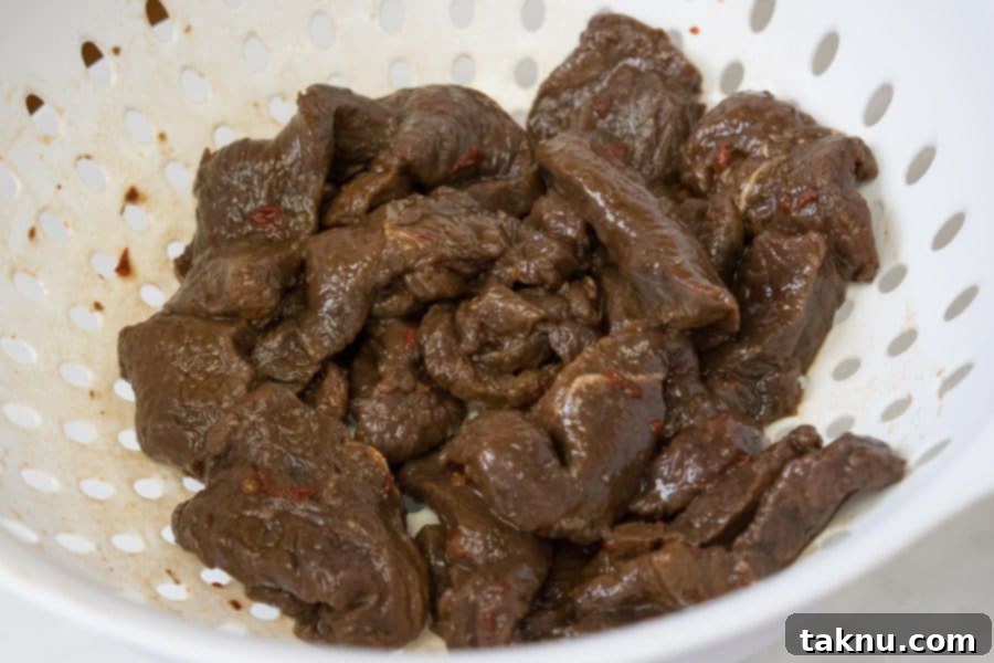 Reaper's Harvest Elk Jerky 5 Elk jerky strips marinating in a fiery Carolina Reaper marinade