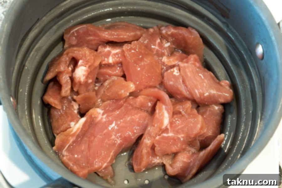 Sweet Maple Pork Jerky in Colander after straining marinade