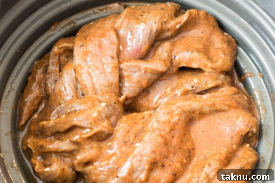 Straining beef jerky in a colander