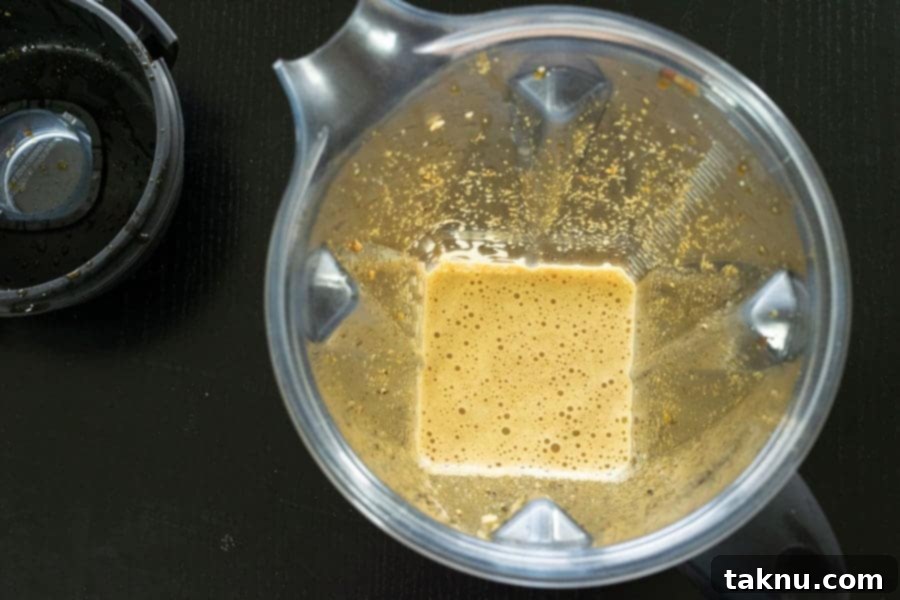 Finely blended, vibrant green jalapeño marinade for beef jerky, ready to infuse the meat with spicy flavor