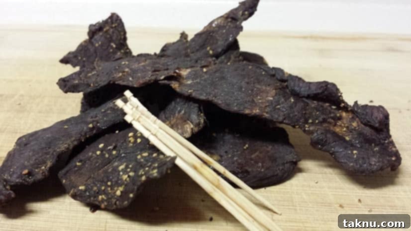 A close-up shot of perfectly dried homemade basic beef jerky strips.