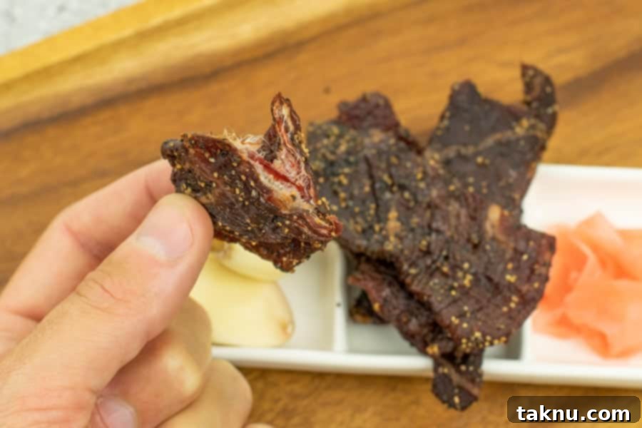 Kikkoman Glazed Teriyaki Beef Jerky 11 Beef jerky finished cracked in half