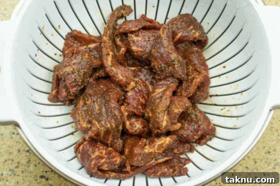 Kikkoman Glazed Teriyaki Beef Jerky 9 Jerky Straining in colander