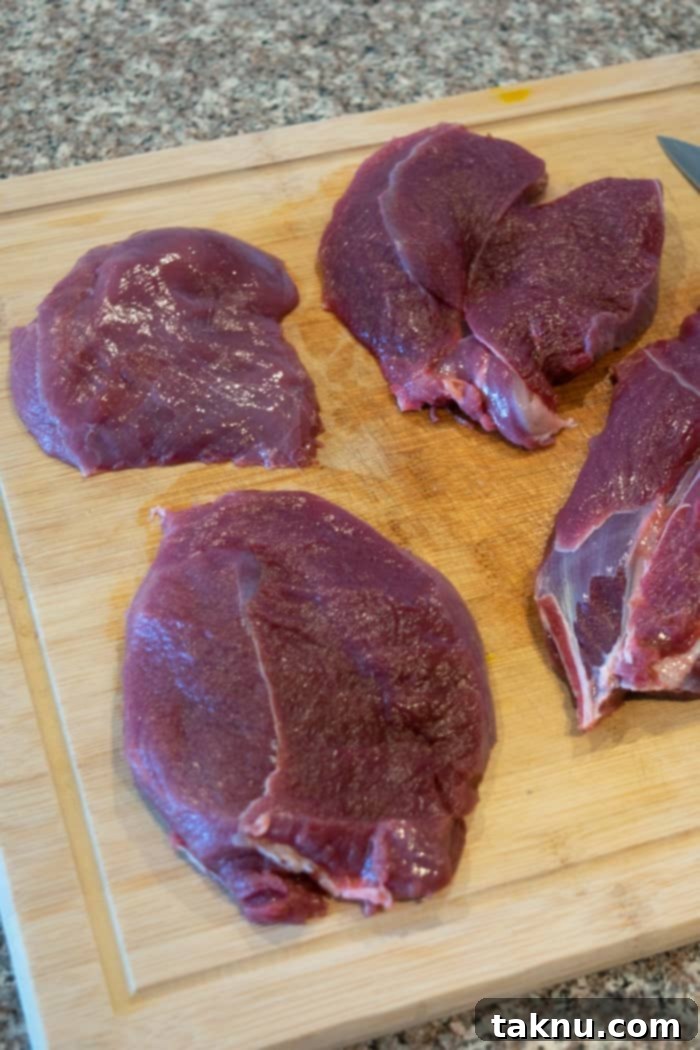 Venison steaks on cutting board