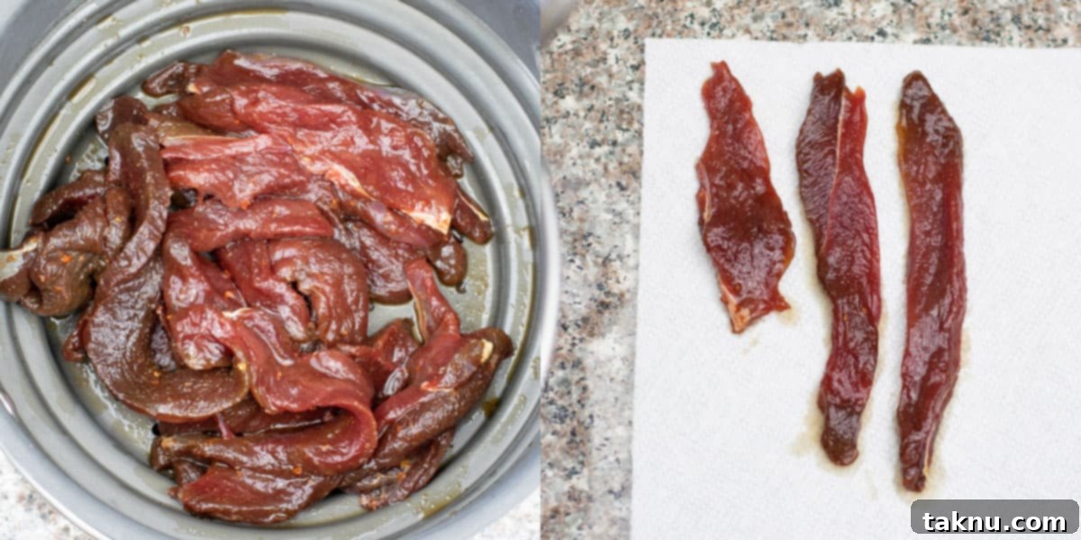 Deer jerky straining in colander and patting dry on paper towels. 