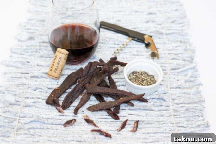 Twisted Venison Jerky 2 Deer jerky with wine, corkscrew, salt, and pepper