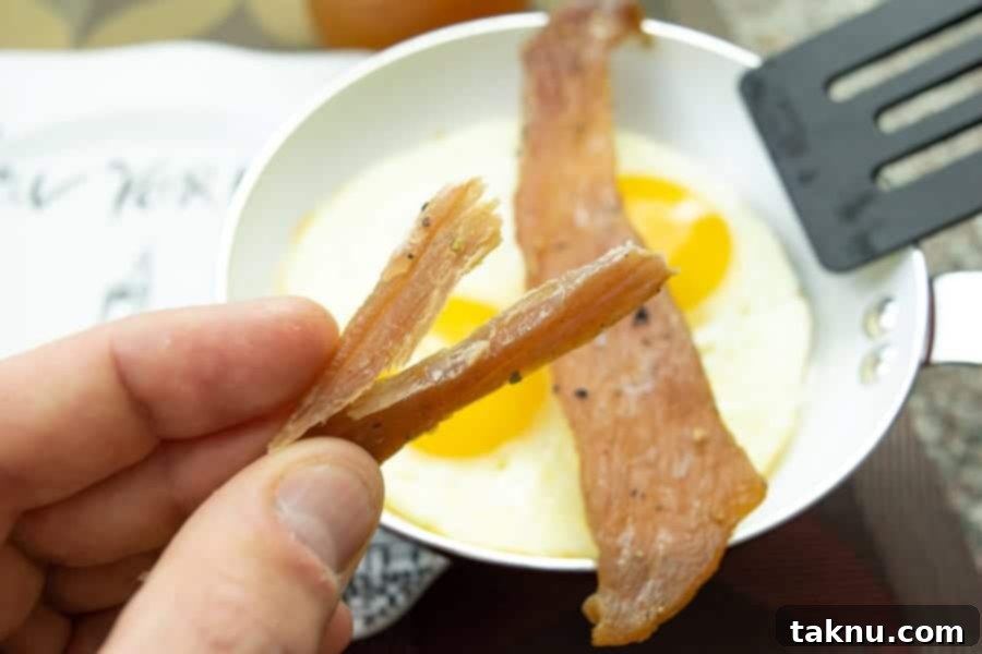 Apple sage jerky ripped in half with eggs