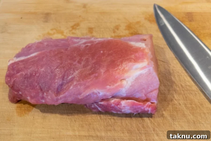 Pork Loin with fat trimmed on cutting board