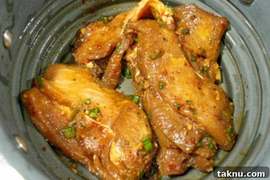 Korean BBQ pork jerky straining in colander