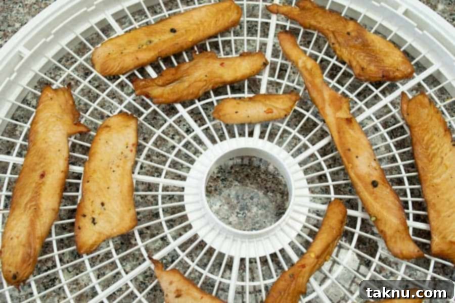 Bourbon jerky on dehydrator tray