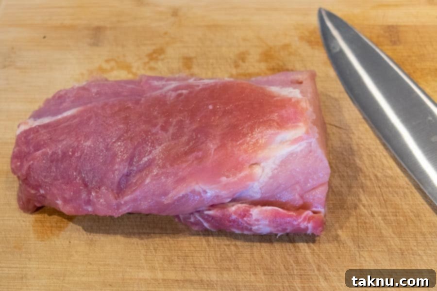 Pork Loin with fat trimmed on cutting board