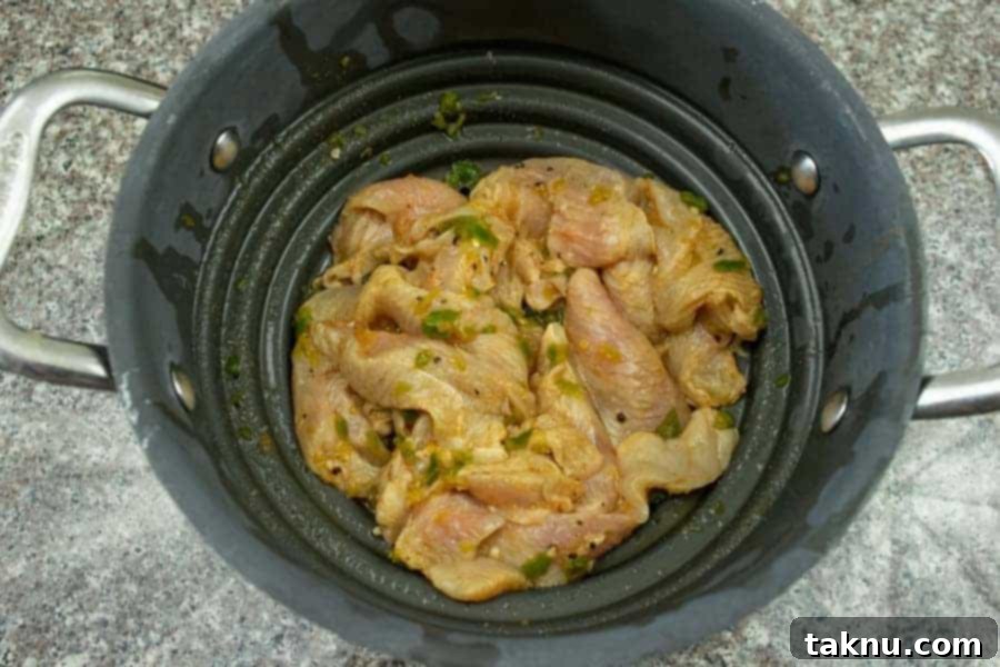 Turkey jerky straining in colander before drying