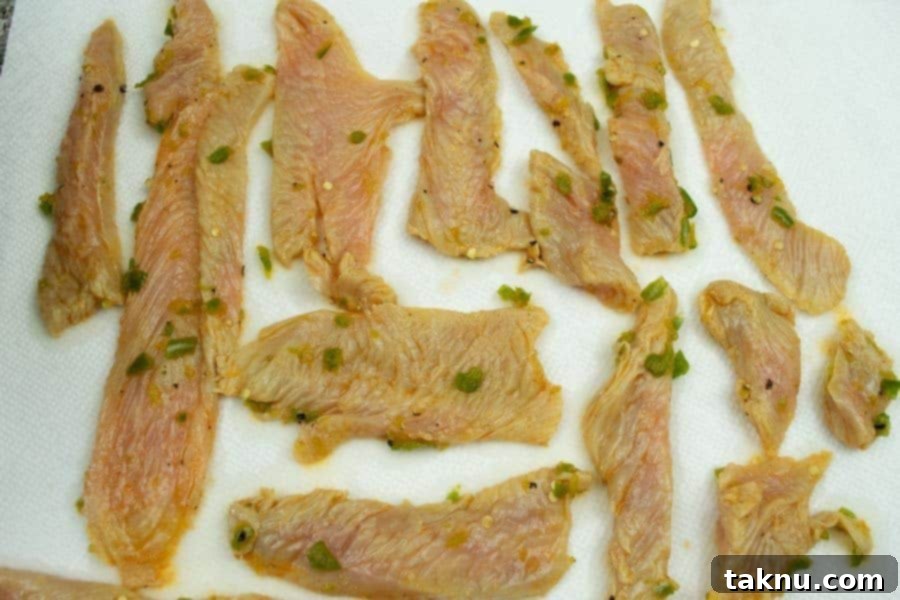 Turkey jerky drying on paper towels