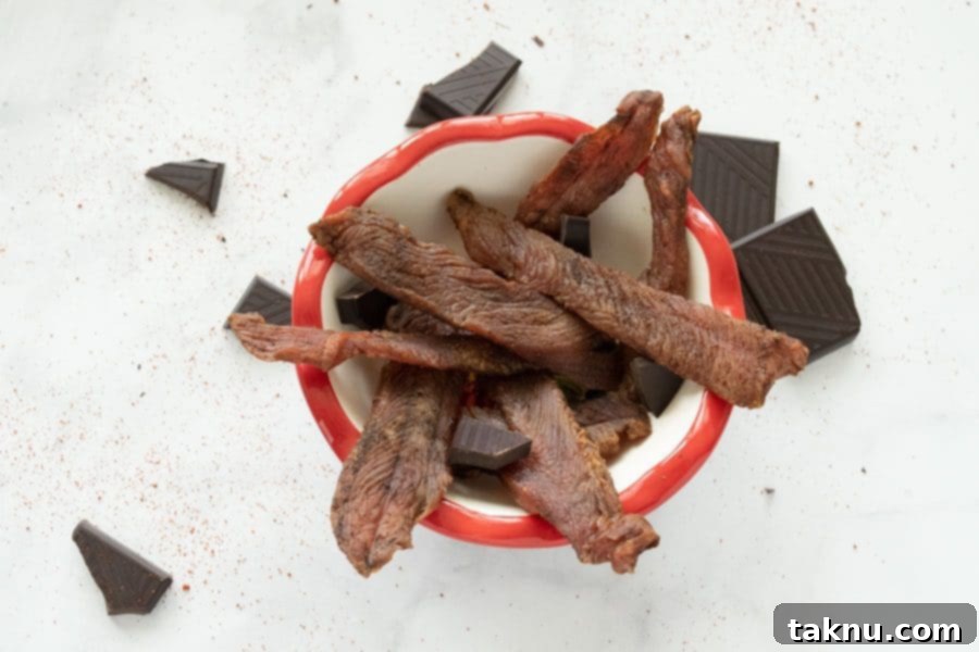 Indulgent Mole Turkey Jerky 11 Mole turkey jerky in bowl with chocolate
