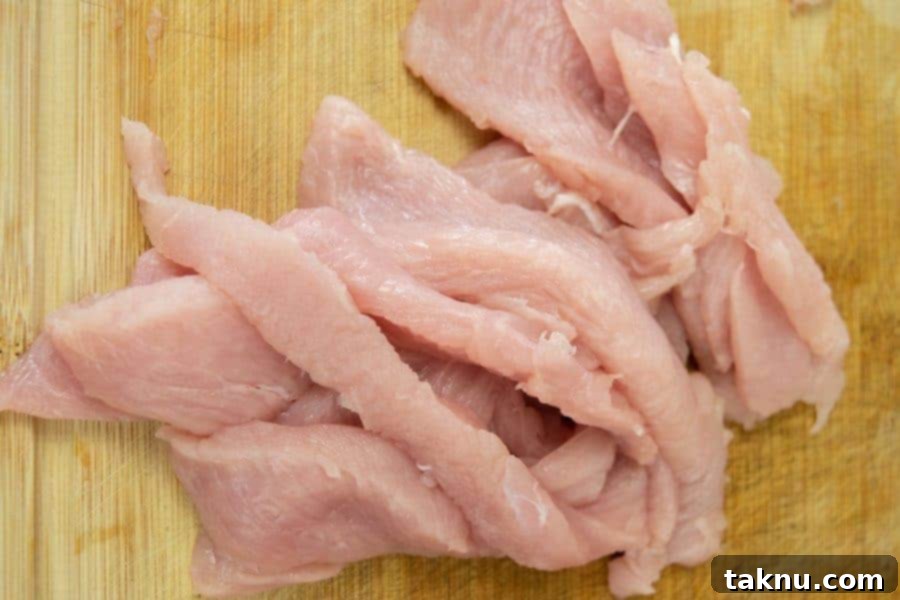 Indulgent Mole Turkey Jerky 4 Turkey breast sliced for jerky on cutting board