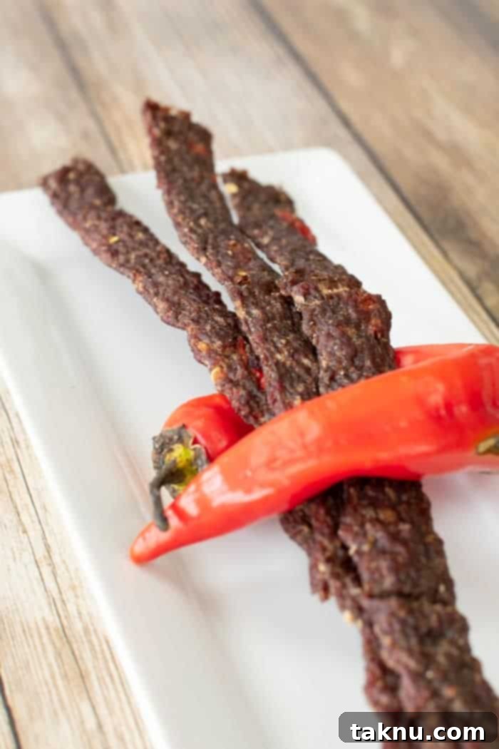 Spicy ground beef jerky wrapped by a hot banana pepper