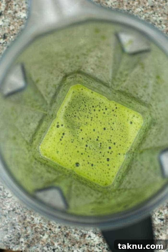 Umami Mushroom Jerky 7 The blended jerky marinade, a smooth and slightly foamy liquid, shown inside a high-speed blender, demonstrating its readiness for marination.