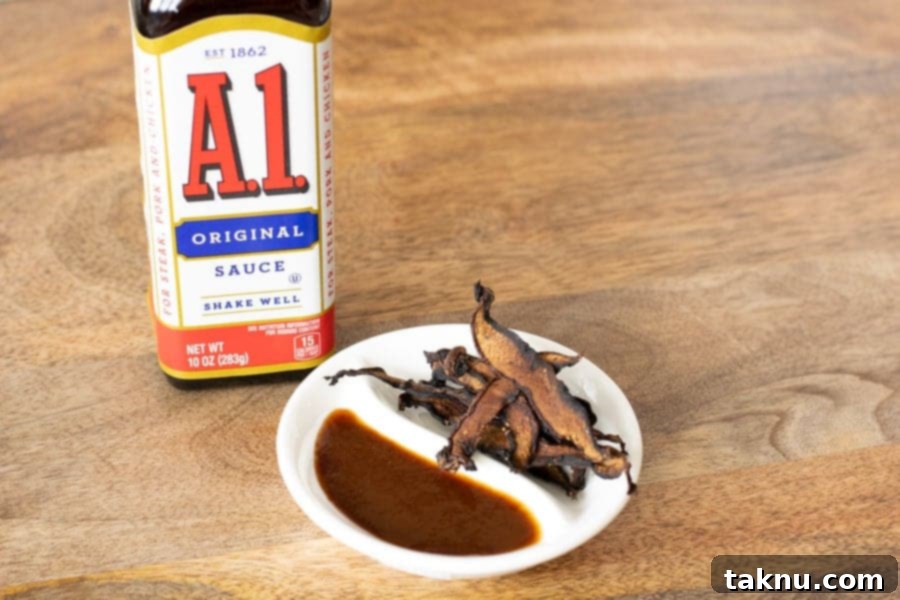 A1 sauce bottle and mushroom jerky on white plate on table