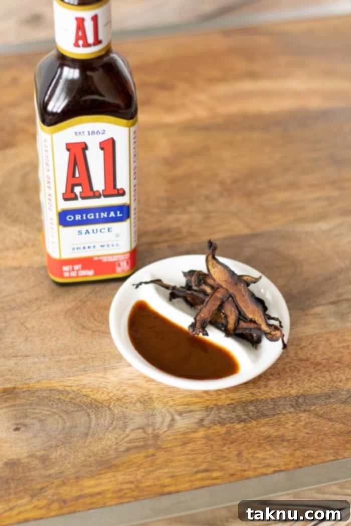 mushroom jerky on white dish on cutting board with A1 steak sauce bottle