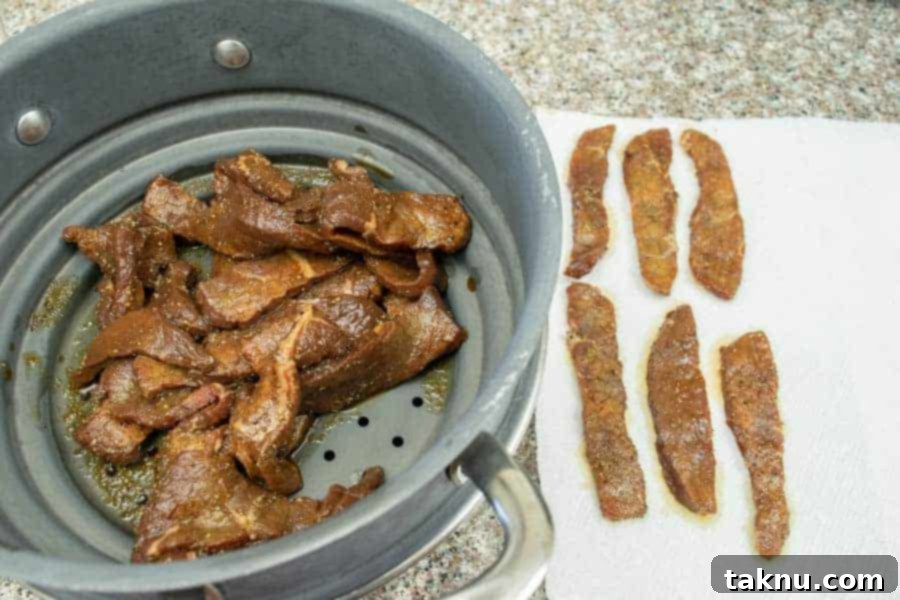 Vintner's Mash Beef Jerky 9 Jerky strips drying on paper towels before dehydration