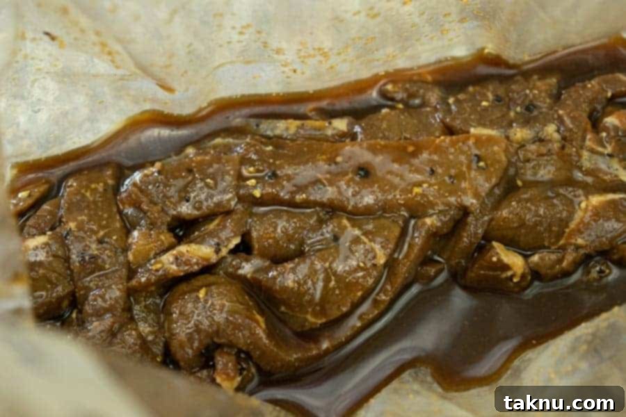 Lemon pepper jerky marinating in bag