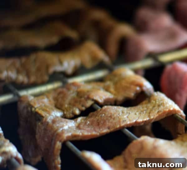Kings County's Smoked Jerky sliced and neatly arranged on a tray, ready for drying