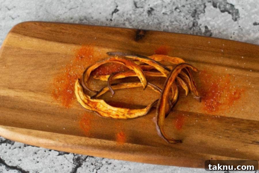 Tomato Eggplant jerky on wood cutting board