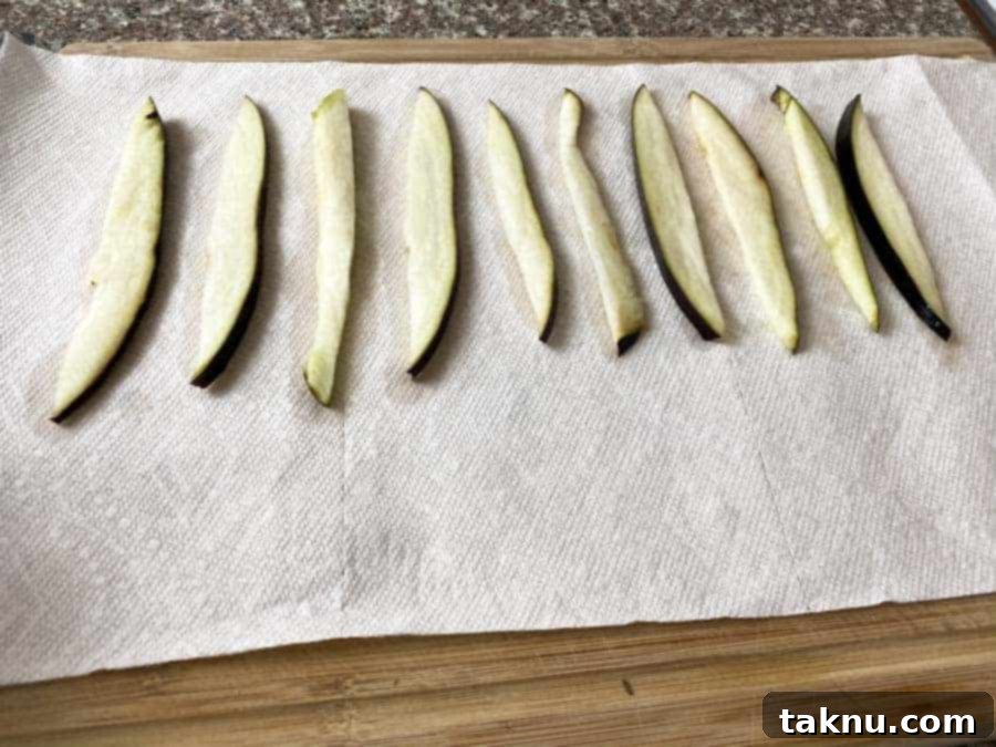 Eggplant slices on paper towel