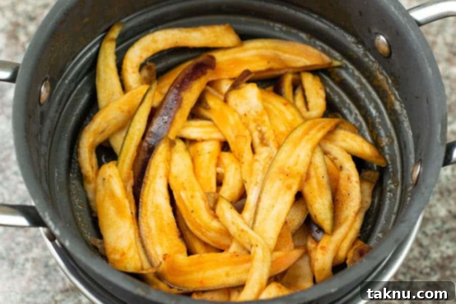 Eggplant jerky drained in colander