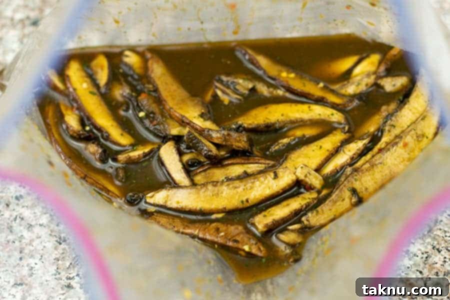 Tangy Umami Mushroom Bites 7 Mushroom slices in marinade in ziplock bag