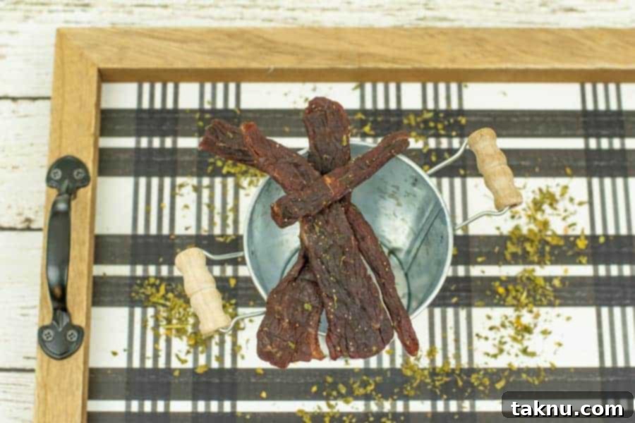 Finished jerky on a tray with parsley garnish