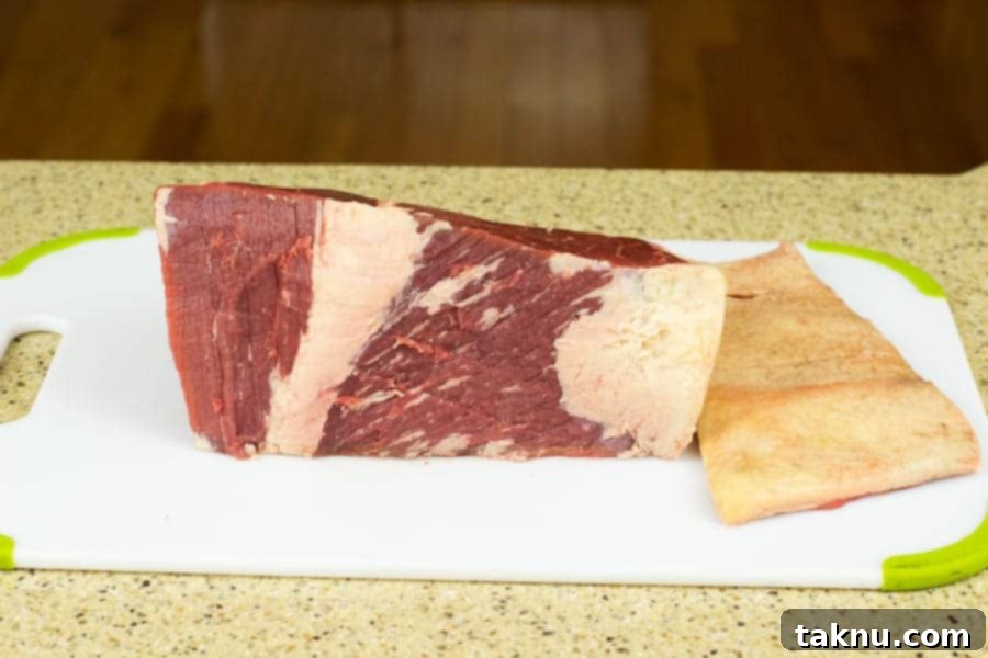 Beef Bottom Round trimmed of fat cap on a cutting board