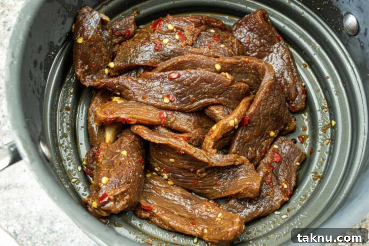 Sesame Glazed Venison Strips 6 Venison jerky strained in colander
