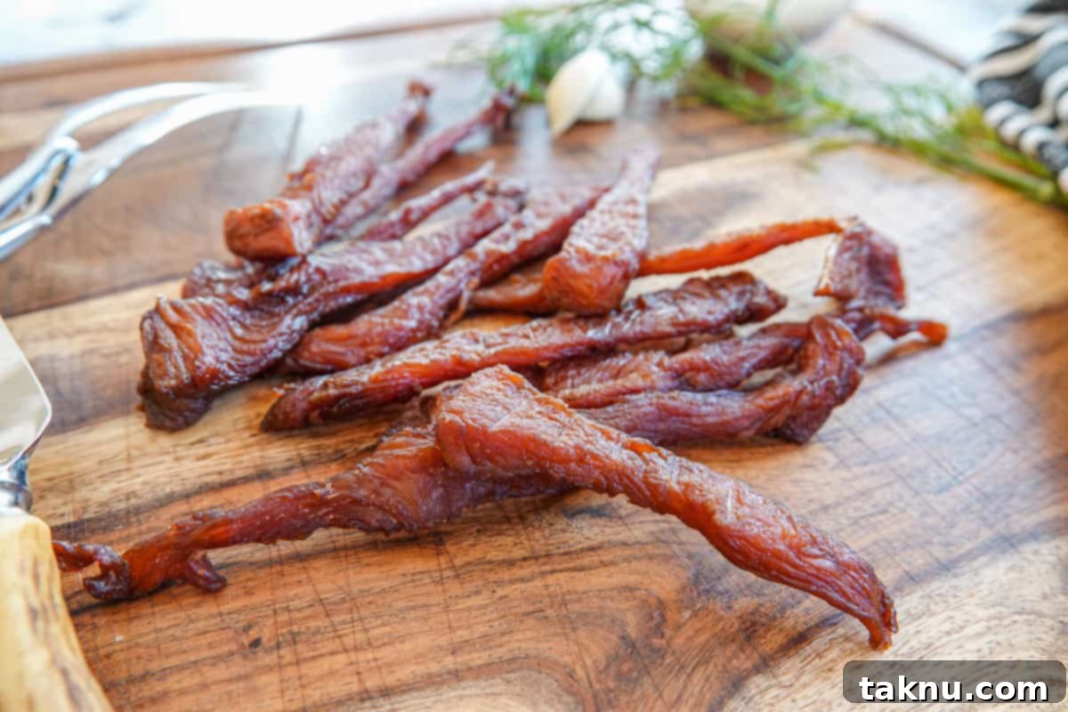 Ultimate Turkey Jerky 8 turkey jerky on cutting board close up