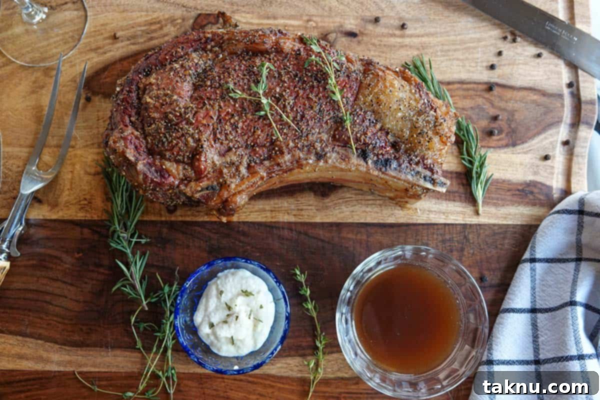 Elegantly presented smoked prime rib on cutting board with horseradish, au jus, knife, and napkin, ready for a special meal.
