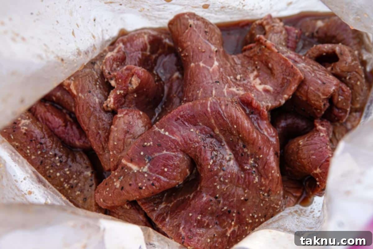 bourbon beef jerky marinating in ziplock bag